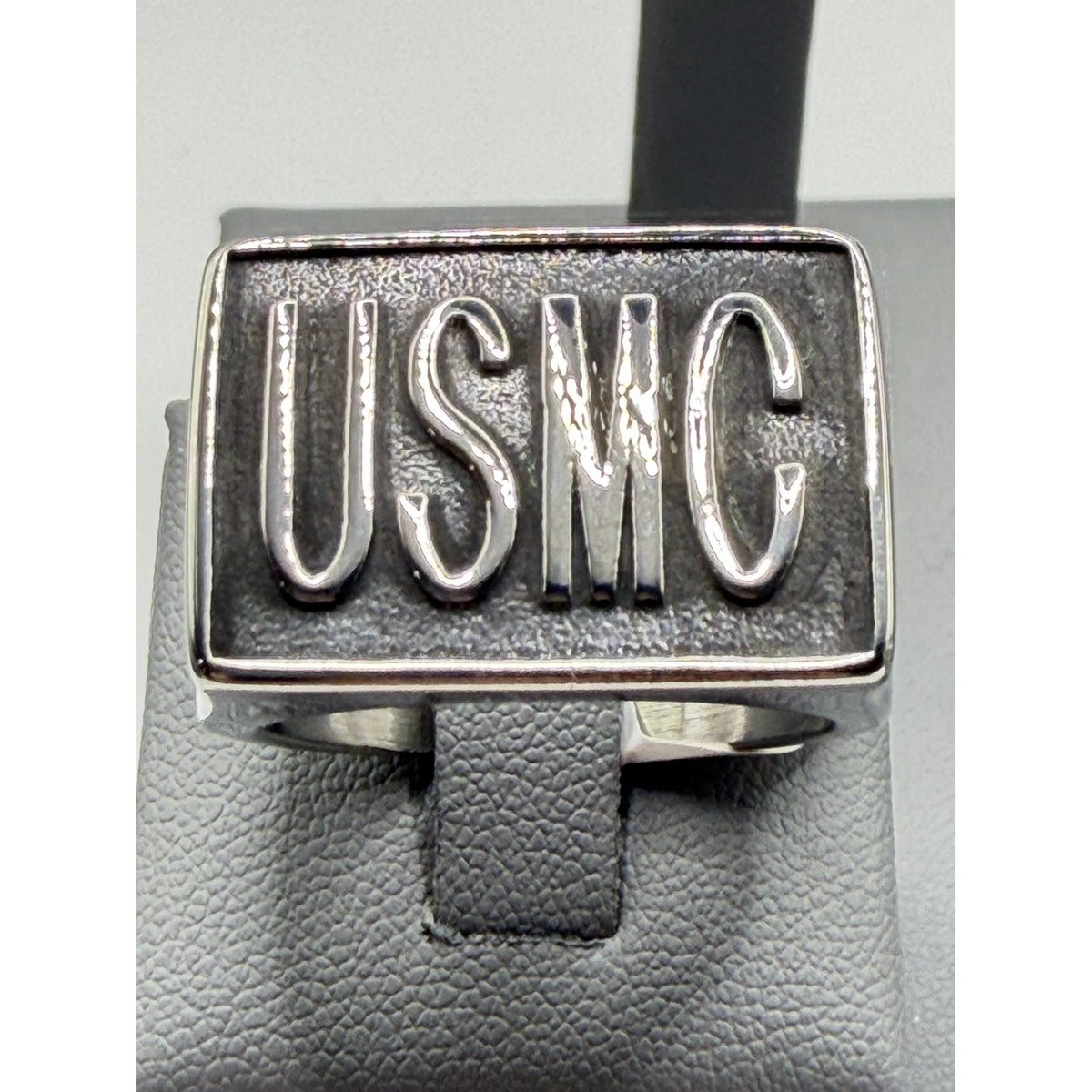 Silver men's US Marine Corps signet ring with engraved USMC emblem, size 11, featuring detailed military insignia.