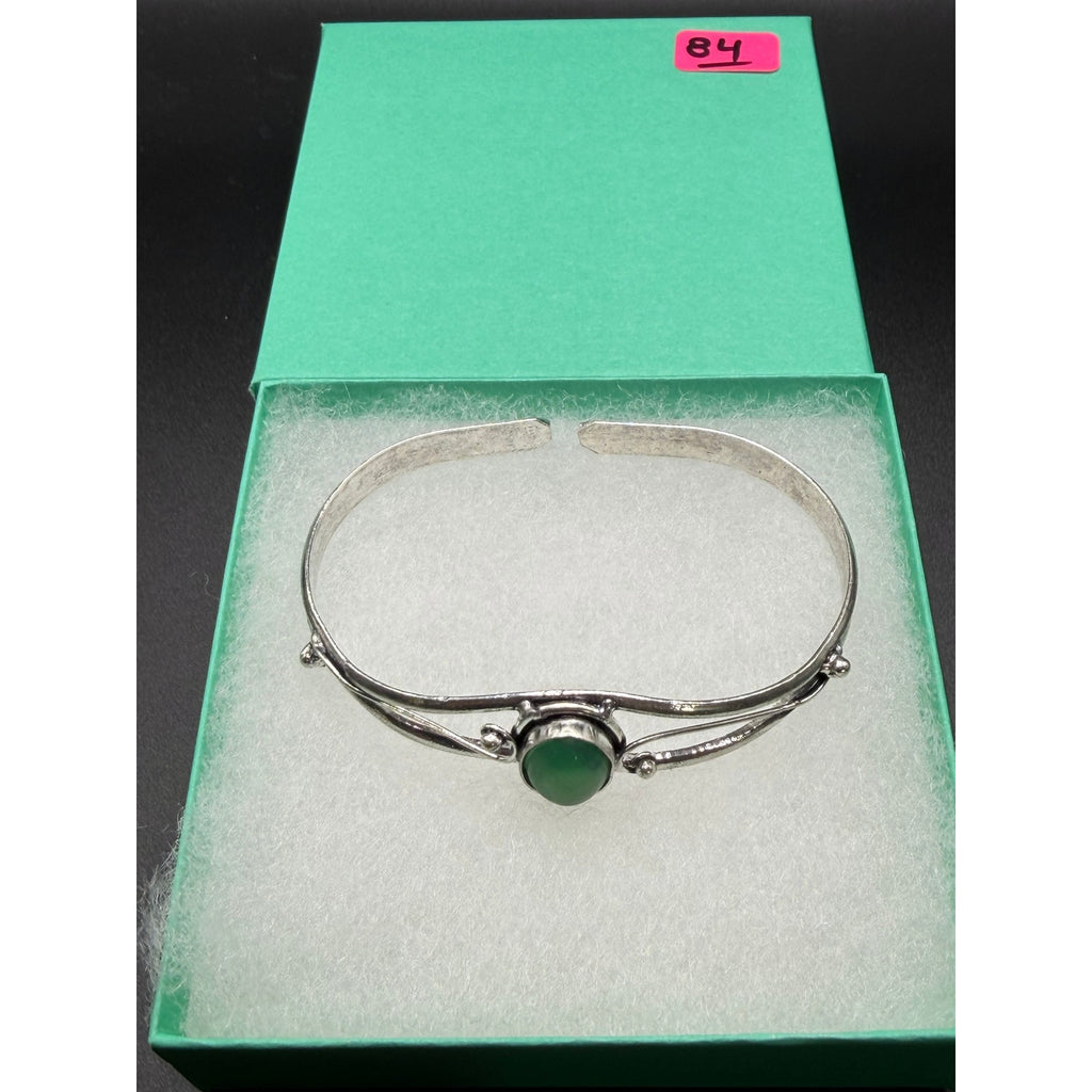 Silver plated bangle gem bracelet with handcrafted design, featuring sparkling gemstones and intricate metalwork from Republic Mercantile.