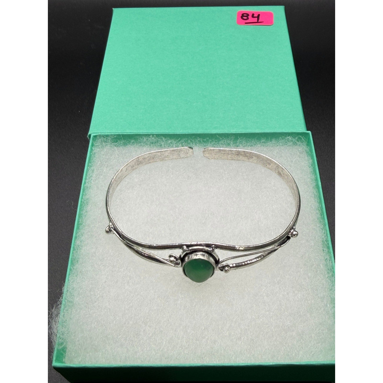 Silver plated bangle gem bracelet with handcrafted design, featuring sparkling gemstones and intricate metalwork from Republic Mercantile.