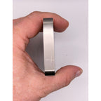 Ten Troy oz CMC Mint .999 fine titanium collectible bar with detailed engravings and brand logo visible in the image.