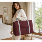 Nice Travel burgundy travel tote bag measuring 11 by 16.5 inches, featuring sturdy handles and a spacious interior.