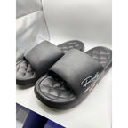 Black Busy Lion Reality Summer Adventures slides in size 9.5-10, featuring a fun lion design and casual slide sandal style.