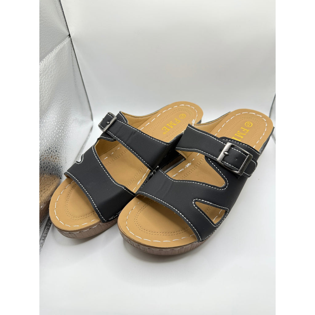 FME Comfort slide sandals in black with buckle details, size 7, featuring a casual open-toe design and cushioned footbed.