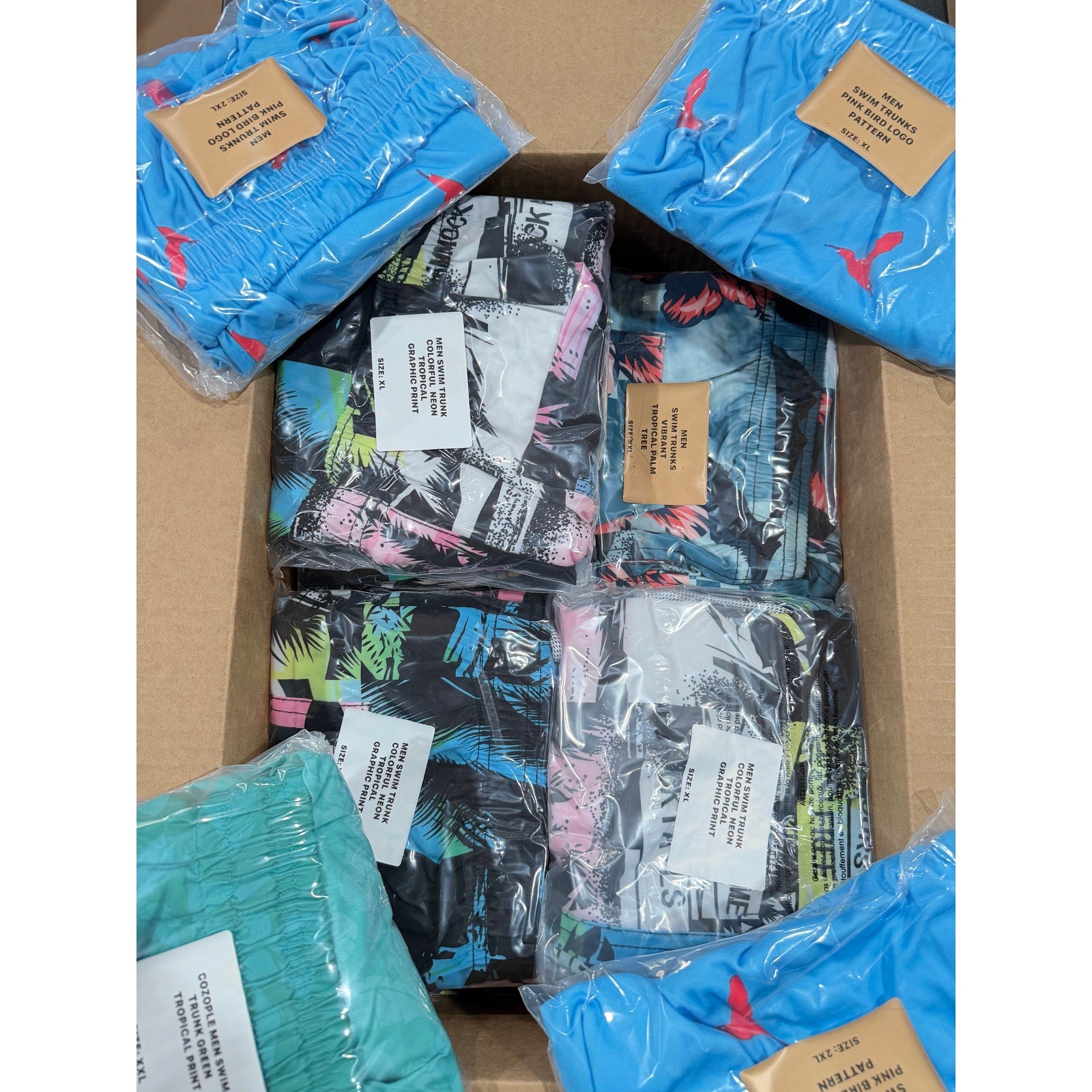Men's swim trunks from Republic Mercantile, 45-piece wholesale lot, new condition, packed for resale, weighs 18 pounds.