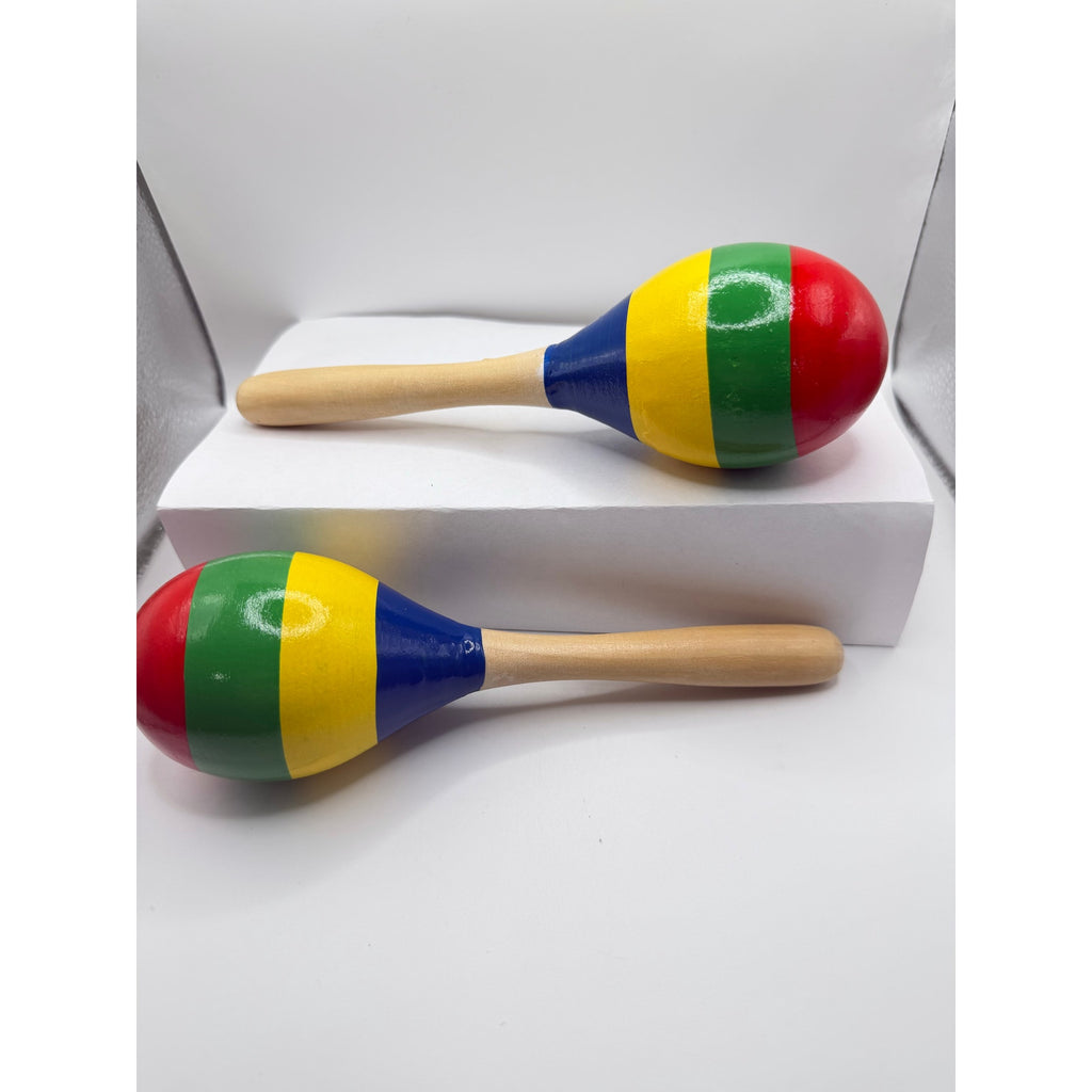 Pair of colorful wooden Latin maracas with vibrant patterns, used as rumba shakers for musical rhythm and percussion.