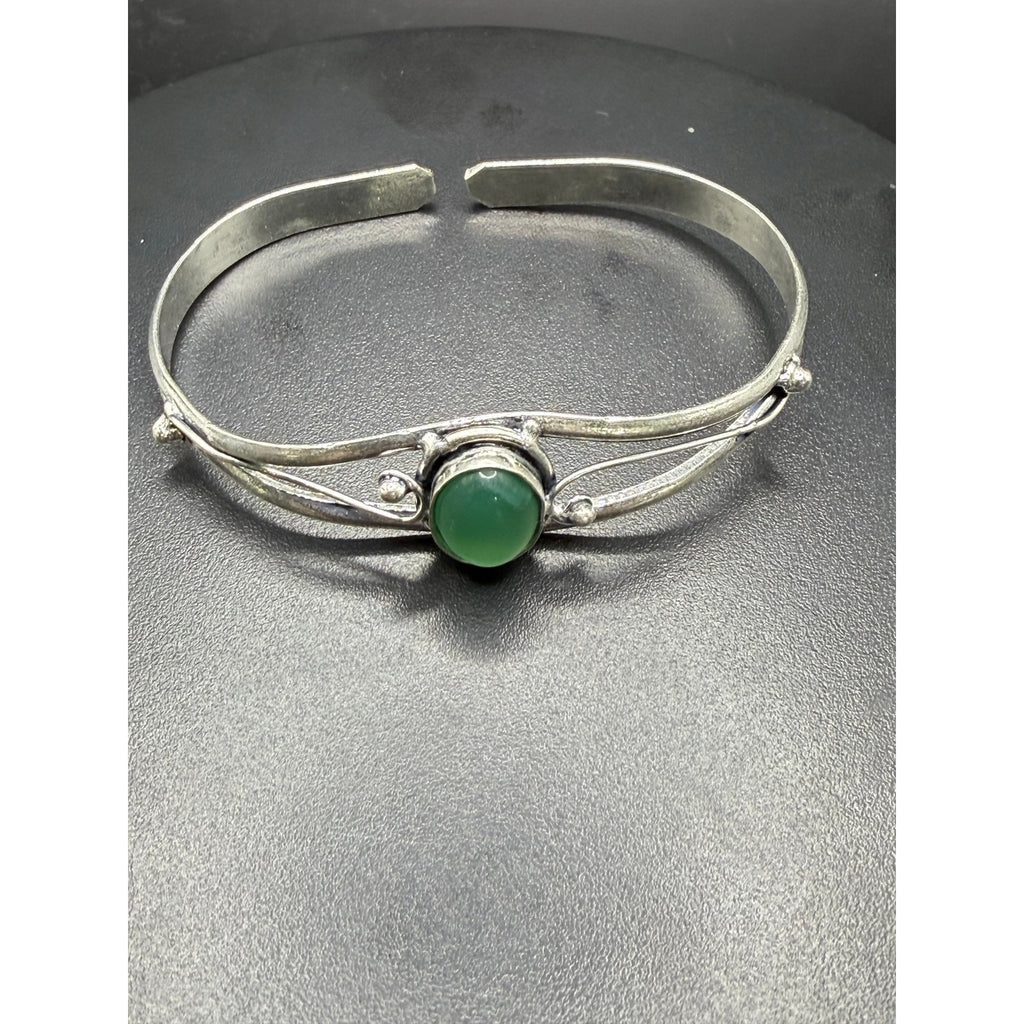 Silver plated bangle gem bracelet with handcrafted design, featuring sparkling gemstones and intricate silver detailing.