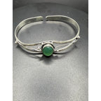 Silver plated bangle gem bracelet with handcrafted design, featuring sparkling gemstones and intricate silver detailing.