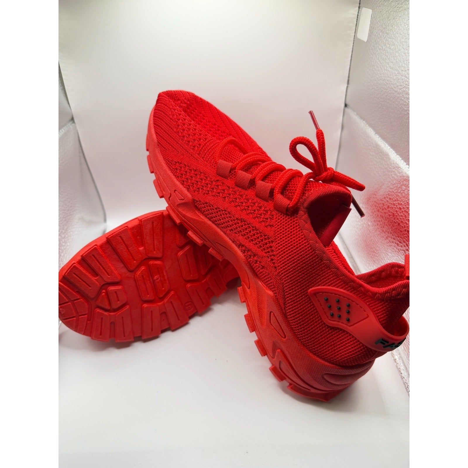 Red women's athletic sneakers by Republic Mercantile, size 10.5, with sleek design and breathable material.